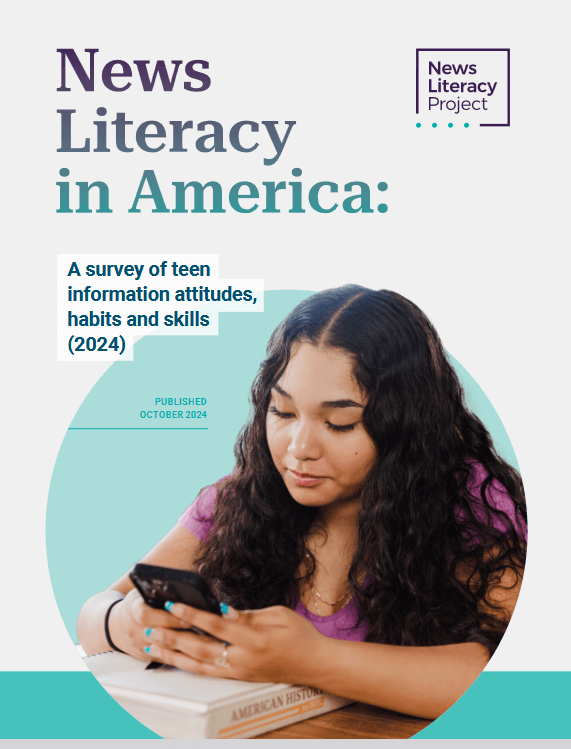 Cover image with title: News Literacy in America: a survey of teen information attitudes, habits, and skills, 2024. A young woman examines a mobile phone, her arms resting on a textbook titled American History.
